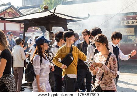 TOKYO JAPAN-October 20: Crowded people heading to the Buddhist Temple Sensoji on October 20 2016 in Tokyo Japan. The Sensoji temple in Asakusa area is the oldest temple in Tokyo.