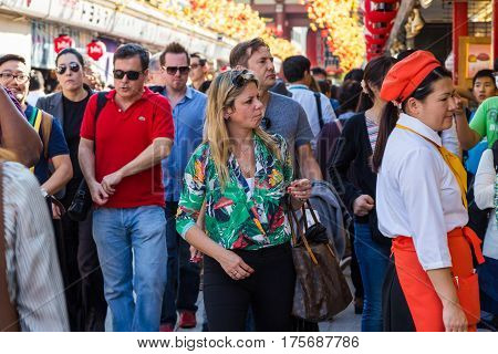 TOKYO JAPAN-October 20: Crowded people heading to the Buddhist Temple Sensoji on October 20 2016 in Tokyo Japan. The Sensoji temple in Asakusa area is the oldest temple in Tokyo.