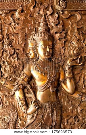 UDON THANI,THAILAND - JAN 25,2014: Image of detail at the base of the Diety on bronze in the Wihan of Wat Pa Phu Kon is located in the Udon Thani Province. The temple was built between 2010 and 2013.