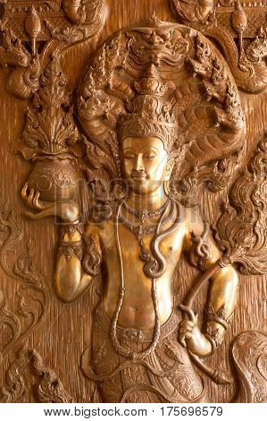 UDON THANI,THAILAND - JAN 25,2014: Image of detail at the base of the Diety on bronze in the Wihan of Wat Pa Phu Kon is located in the Udon Thani Province. The temple was built between 2010 and 2013.