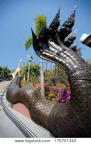 UDON THANI,THAILAND - JAN 25,2014: Image of Thai art of 7 heads Serpent on staircase to Chedi Prathom Rattanamahaburaphachan. The Chedi in Sri Lanka style,in Wat Pa Phu Kon of Na yung in Udon Thani Province,Thailand.