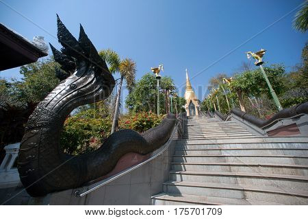 UDON THANI,THAILAND - JAN 25,2014: Image of Thai art of 7 heads Serpent on staircase to Chedi Prathom Rattanamahaburaphachan.The Chedi in Sri Lanka style,in Wat Pa Phu Kon of Na yung in Udon Thani Province,Thailand.