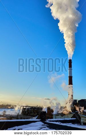 the thick smoke belching from factory chimneys
