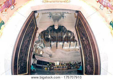 UDON THANI,THAILAND-JANUARY 25,2014 : The 20-meter long reclining Buddha, which is made from 43 blocks of exquisite Italian Carrara Marble, in Wat Pa Phu Kon of, Ban Na Kham, Ban Kong sub-district , Na yung District in Udon Thani Province, Thailand.