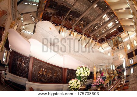 UDON THANI,THAILAND-JANUARY 25,2014 : The 20-meter long reclining Buddha, which is made from 43 blocks of exquisite Italian Carrara Marble, in Wat Pa Phu Kon of, Ban Na Kham, Ban Kong sub-district , Na yung District in Udon Thani Province, Thailand.