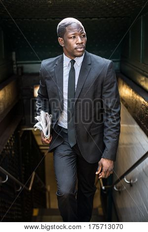 Businessman in full suit at Wall Street subway metro station