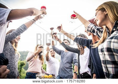 Group of friends at restaurant outdoors - People having dinner in a home garden