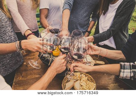 Group of friends at restaurant outdoors - People having dinner in a home garden