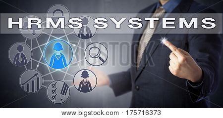 Male recruitment officer in blue shirt and suit is using HRMS SYSTEMS. Business concept and information technology metaphor for human resources management system and workforce planning.