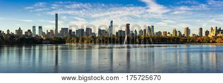 Morning panoramic view of the Central Park Reservoir and Midtown Manhattan skyscrapers in Fall. New York City
