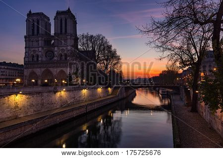 Notre Dame de Paris cathedral at sunrise with the Seine River. Ile de La Cite. 4th Arrondissement Paris France