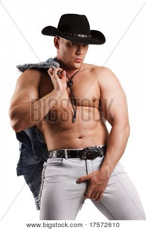 En muskuløs mand i en cowboyhat. Isoleret på hvid.