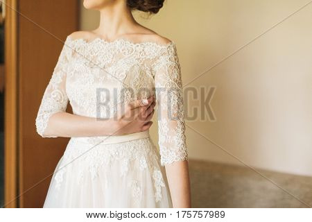 the elegant bride in a wedding lacy dress. morning gatherings of bride.