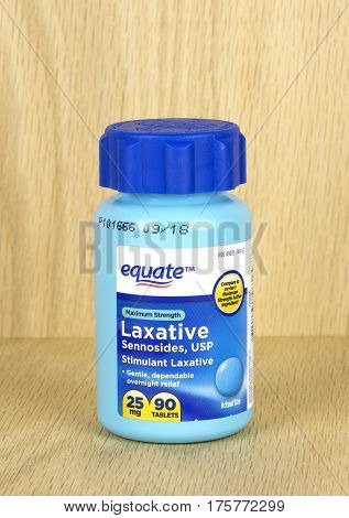 RIVER FALLS,WISCONSIN-MARCH 09,2017: A bottle of Equate brand stimulant laxative with a wood background