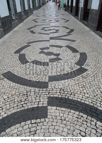 Typical Portuguese black and white stone mosaic 