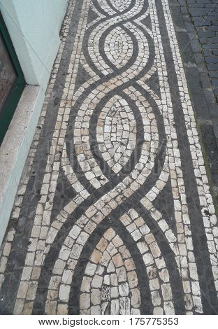 Typical Portuguese black and white stone mosaic 