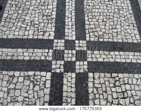 Typical Portuguese black and white stone mosaic 