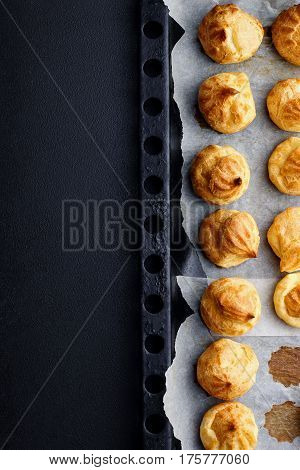Baked Profiteroles On Tray Ready For Croquembouche. Top View. Copy Space