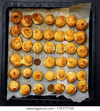 Baked Profiteroles On Tray Ready For Croquembouche. Top View