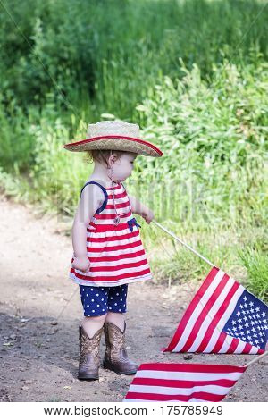 Toddlers having fun in the park for July Fourth.