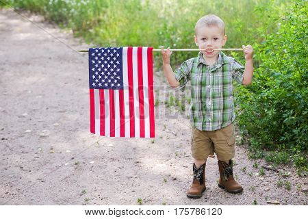 Toddlers having fun in the park for July Fourth.