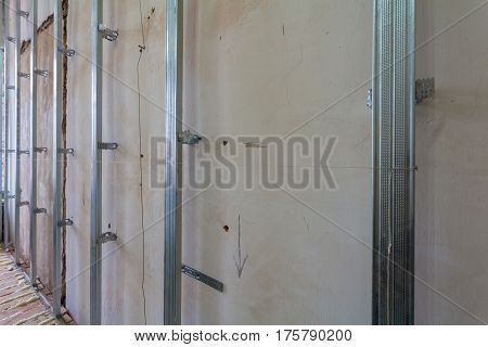 Interior of apartment with materials during on the renovation and construction ( making wall from drywall)