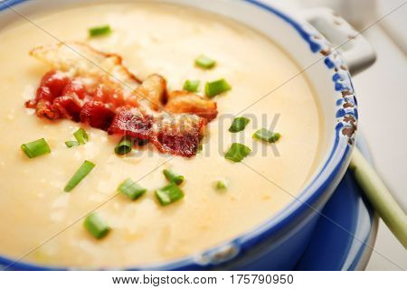 Delicious cream soup with bacon and onion, closeup