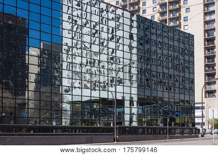 MINNEAPOLIS USA - APRIL 11 2012: Glassy windows reflections in sunny day