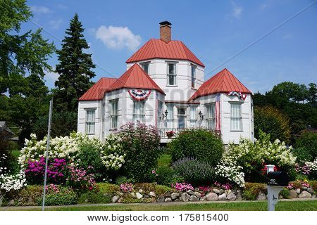 HARBOR SPRINGS, MICHIGAN / UNITED STATES - AUGUST 4, 2016: The Hexagon House, designed by Ephraim Shay as his home in 1892, has 6 hexagonal rooms on the ground floor, and was constructed of stamped steel.