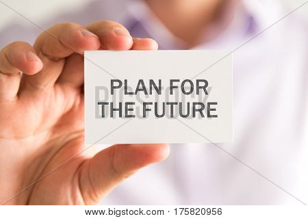 Businessman Holding A Card With Plan For The Future Message