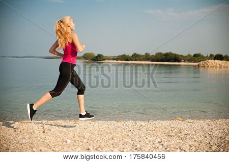 Jogging In Th Beach - Woman Runns Near Sea On Early Summer Morning