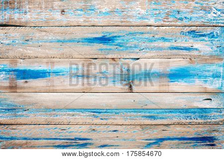 Old wooden background with blue paint. vintage wood texture from beach in summer.