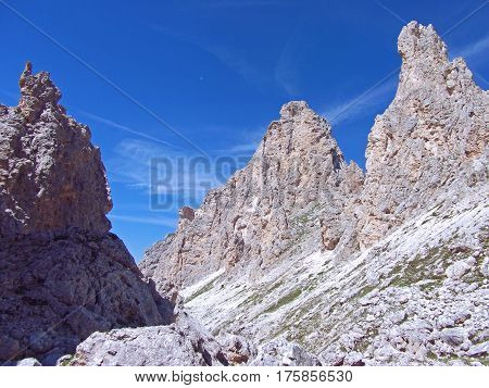 high stone mountain blue sky and moon view in dolomiten dolomites dolomiti Italy