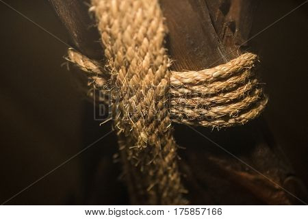 Rope rope coiled on a wooden pillar close