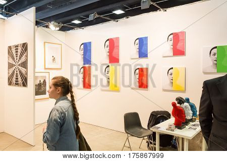 MILAN ITALY - MARCH 10: People visit MIA international photography and moving image art fair on MARCH 10 2017 in Milan.