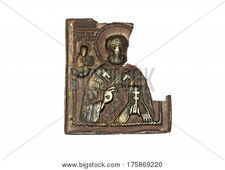 Shattered fragment of the triptych of copper alloy on white. It is approximately the middle of the 19th century.