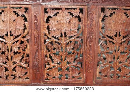 Detail of carved Oriental screen made of wood.