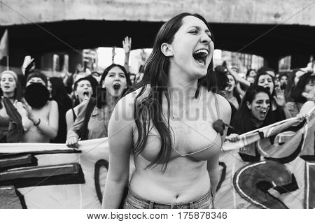 MILAN ITALY - MARCH 8: Secondary school students take part in a march to celebrate the International Women's Day on MARCH 8 2017 in Milan.