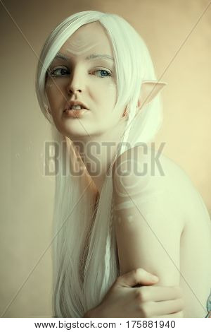 Beauty Portrait Of Girl In Fantasy Image Of An Elf. White Hair And Faceart. Long Elven Ears. Fairy T