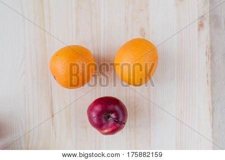 Fresh red and green apple, orange on wooden decks. Fruit, citrus table. Color