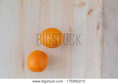 Fresh orange on wooden decks. Fruit, citrus table. Color