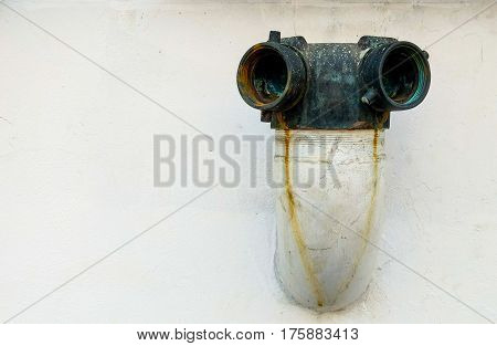 Old vintage fire department connection and rust stains selective focus.