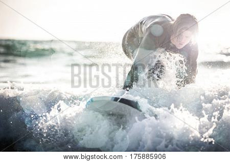 Surfer boy ready to get on the board
