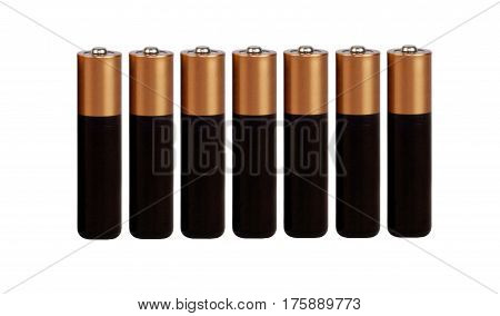 Seven batteries of the type AAA on a white background, isolated