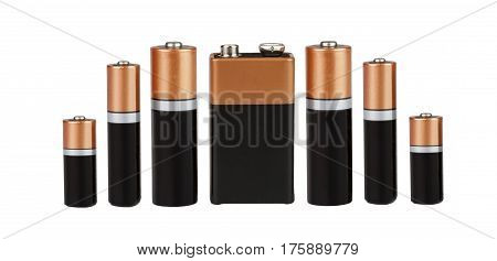 Many different batteries, type AAA, type AA, type PP3, white background, isolated