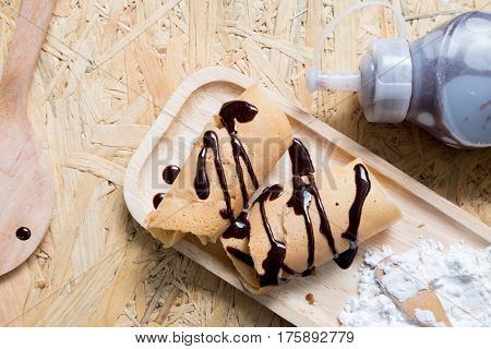 Khanom Tokyo is a thin flat pancake topping with sauce chocolate and icing