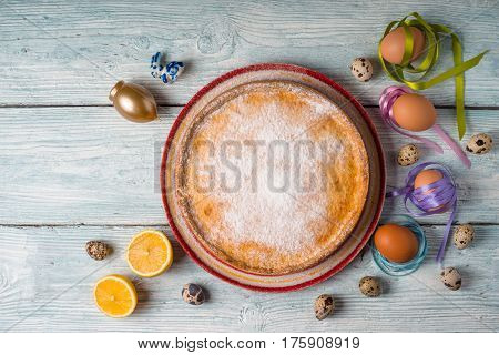 German Easter cake and eggs on white boards horizontal