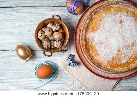 German Easter cake on a platter and quail eggs horizontal