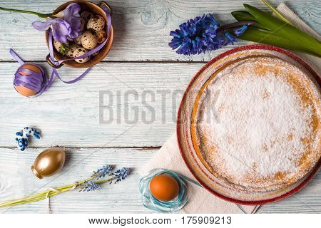 German Easter cake, eggs, flower on the table horizontal