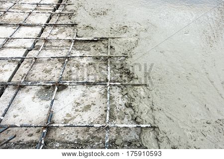 Concrete slab paving on hollow core slab flooring.